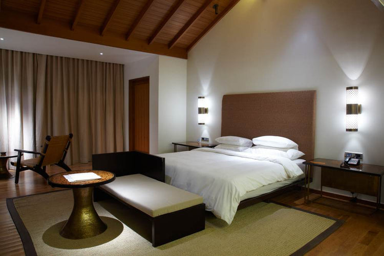 hotel bedroom with lighting either side of the bed