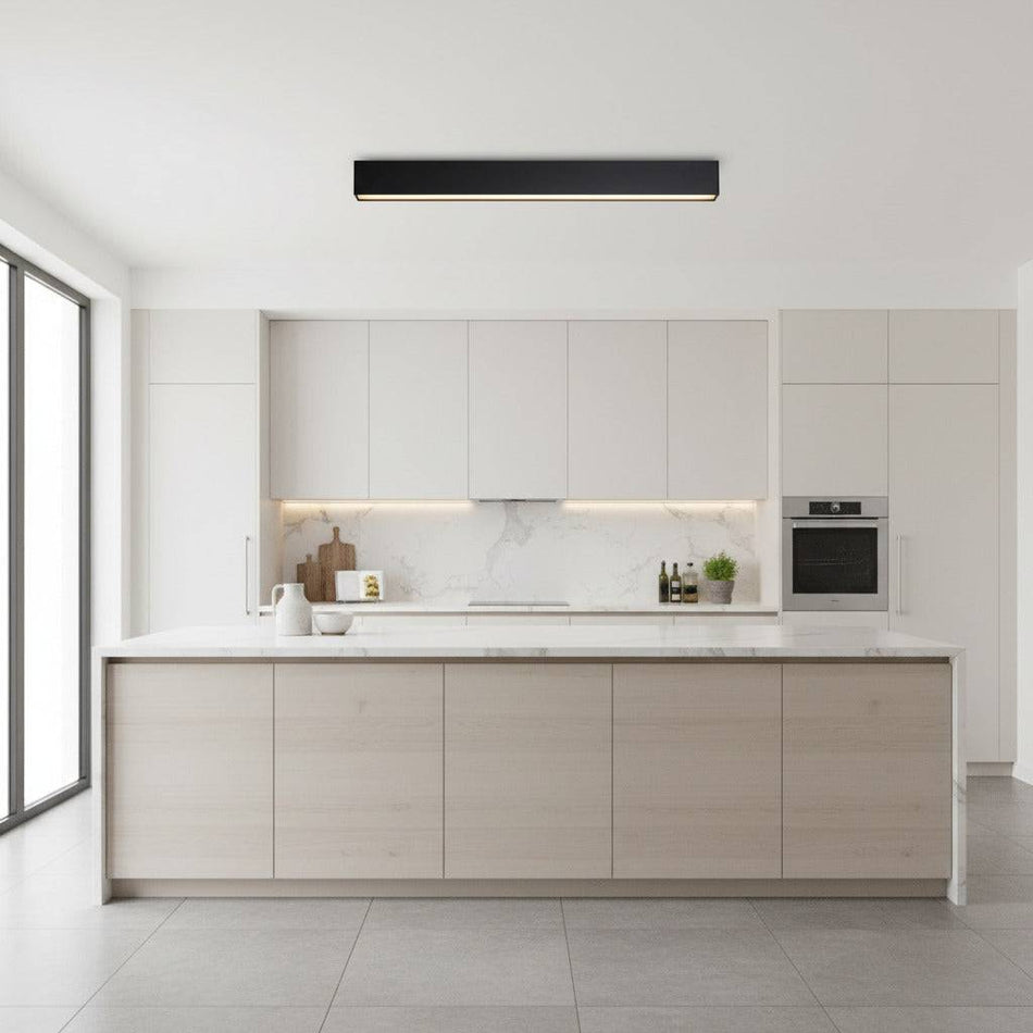 black linear surface downlight mounted on the ceiling in a modern kitchen