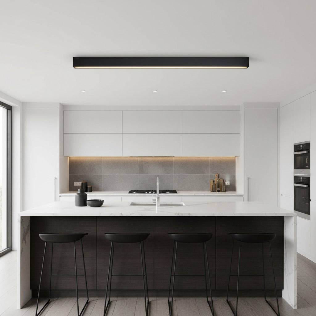 black surface mounted linear light mounted above a kitchen island 