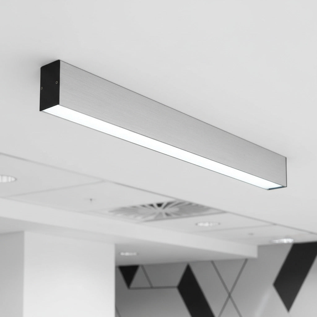 silver slim surface mounted downlight mounted on an office ceiling