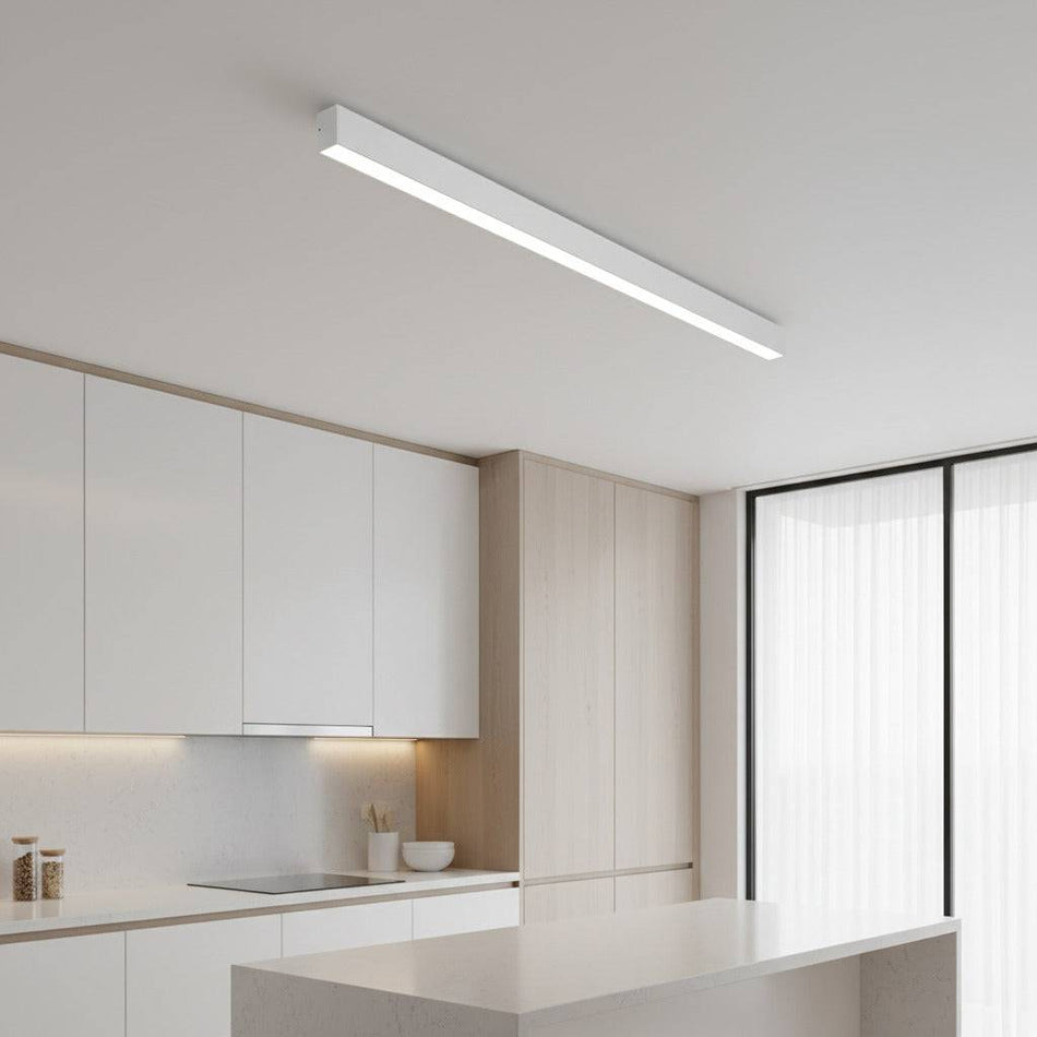 white linear surface mounted light shown on a kitchen ceiling 