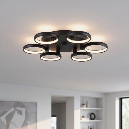 black large flush ceiling light mounted on the ceiling in a large modern room 