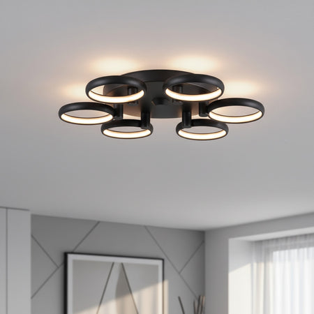 black large flush ceiling light installed in the large living room of a home 