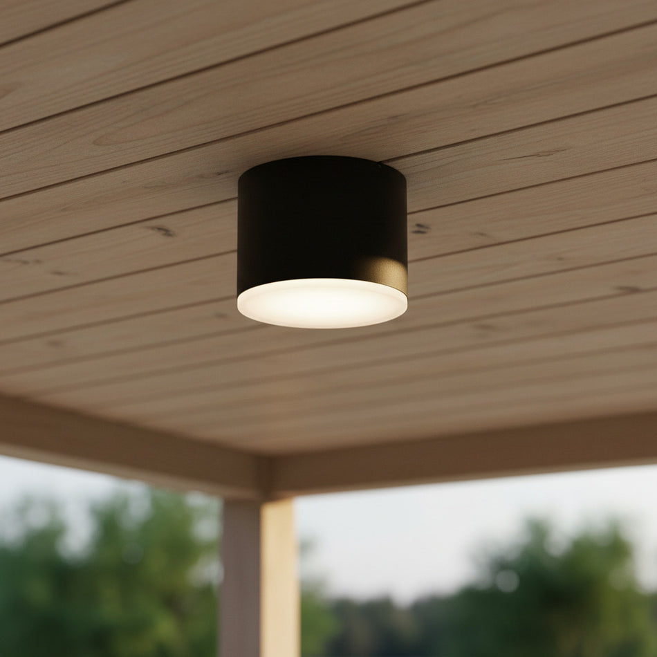 black waterproof outdoor downlight mounted on a wooden outdoor ceiling 