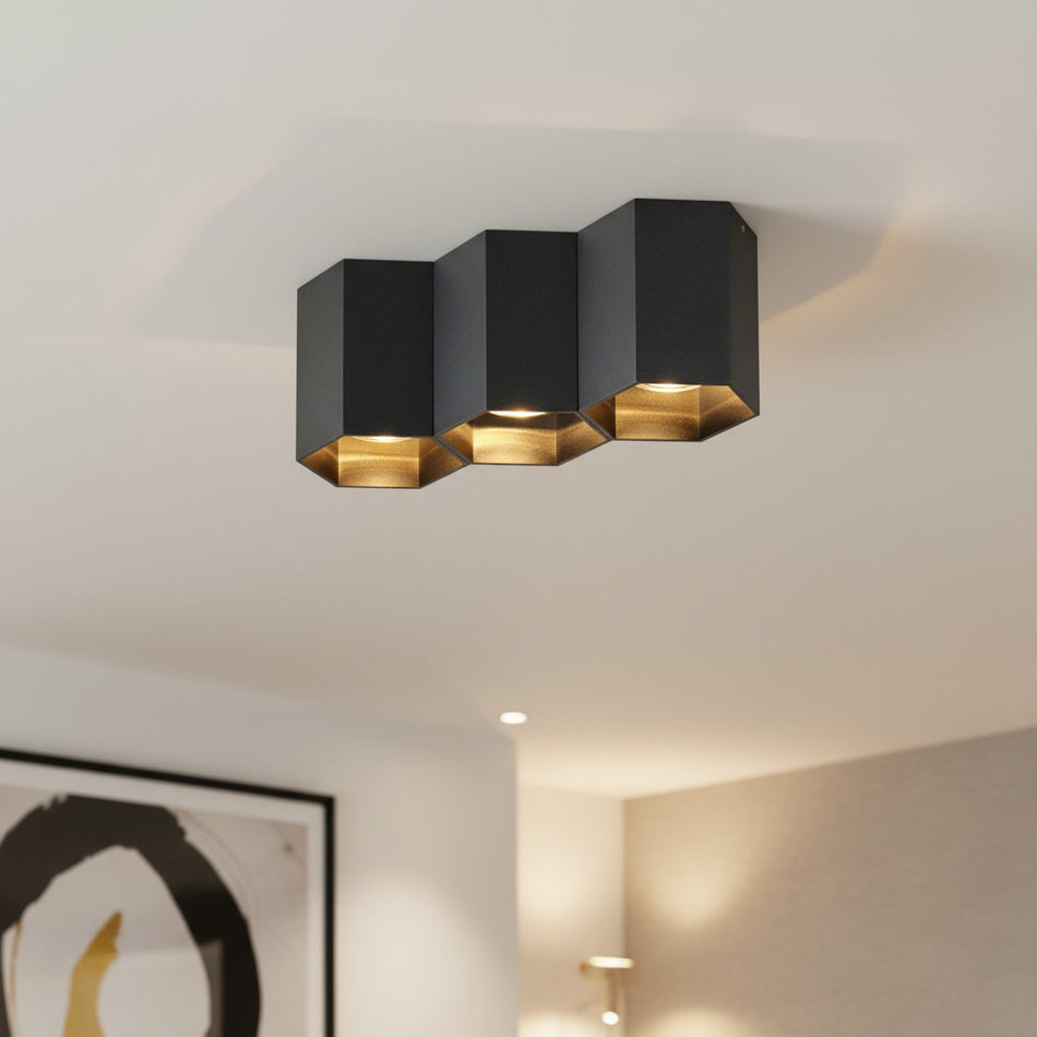 black flush ceiling lamp mounted on the ceiling in a hotel lounge