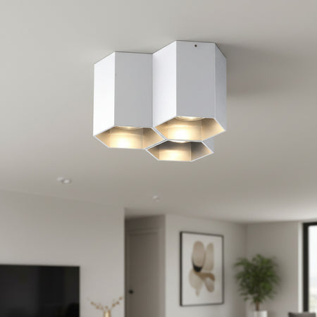 silver ceiling mount light fixture shown on a ceiling in modern house