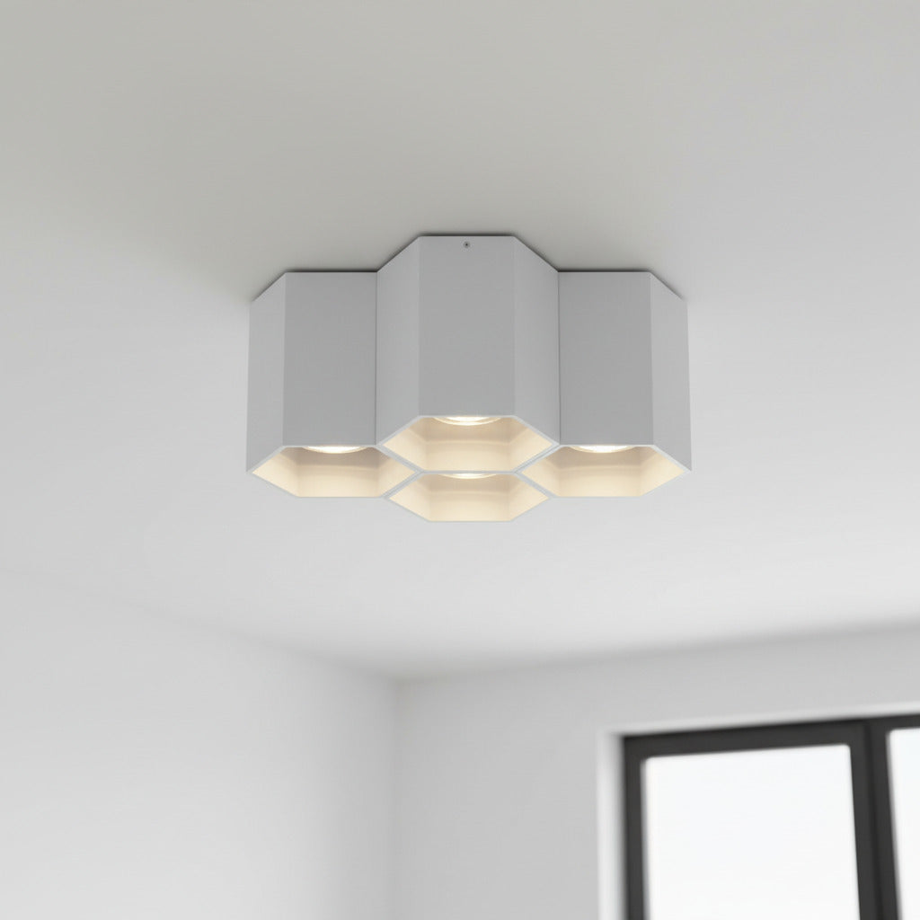 White surface ceiling light mounted on a white ceiling in a modern house