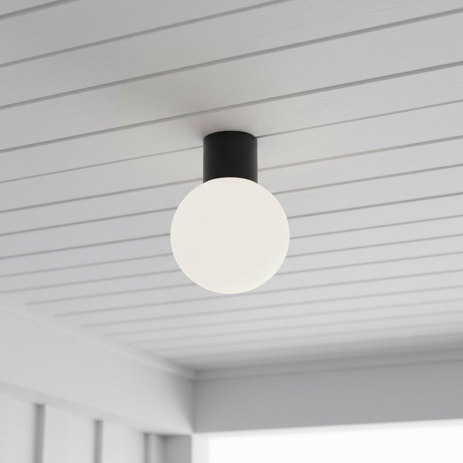 black waterproof outdoor ceiling light mounted on a white outside ceiling 