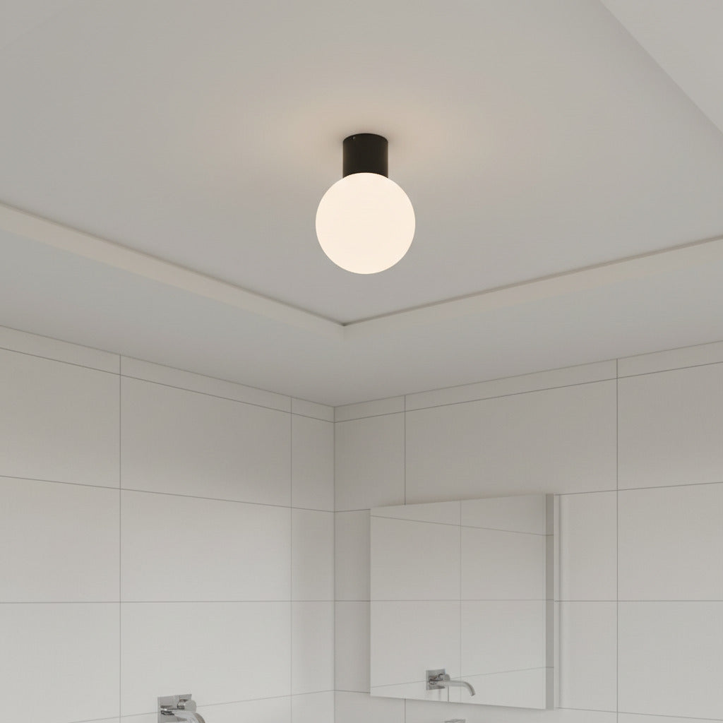 black globe bathroom ceiling light fitted in a small modern bathroom 