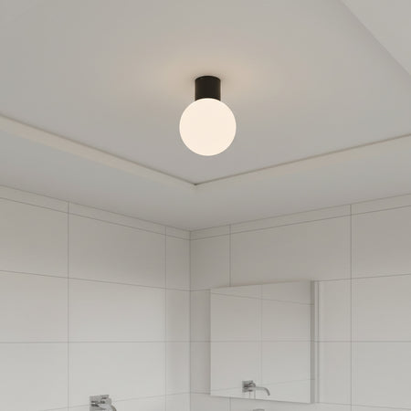 black globe bathroom ceiling light fitted in a small modern bathroom 