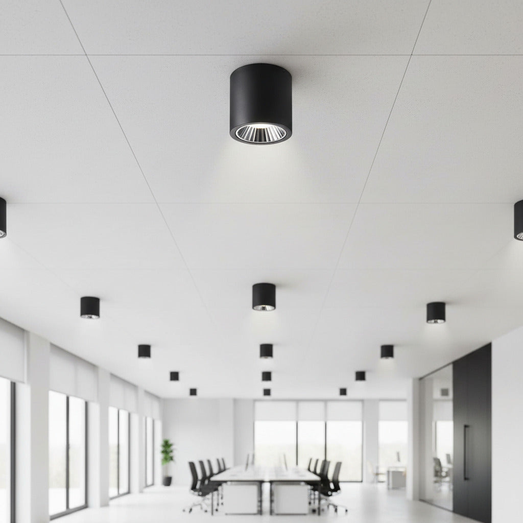 black large flush mount ceiling light mounted in an office boardroom