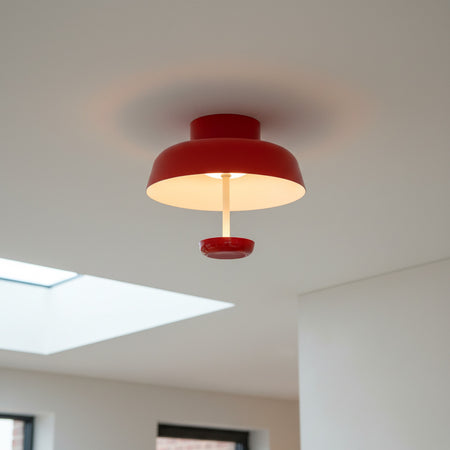 red modern semi flush ceiling light mounted in the kitchen of a home