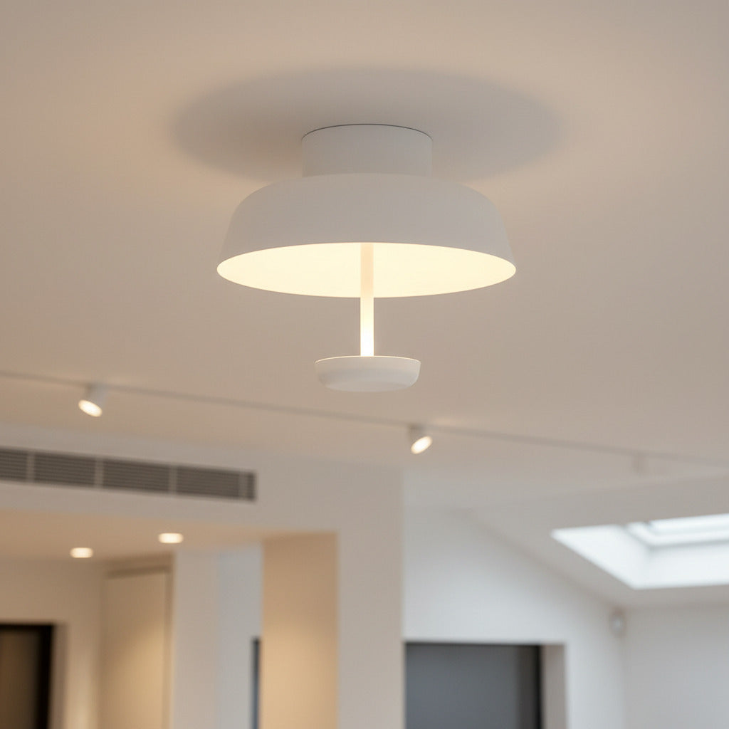 white flush mounted ceiling light mounted in a hotel room 