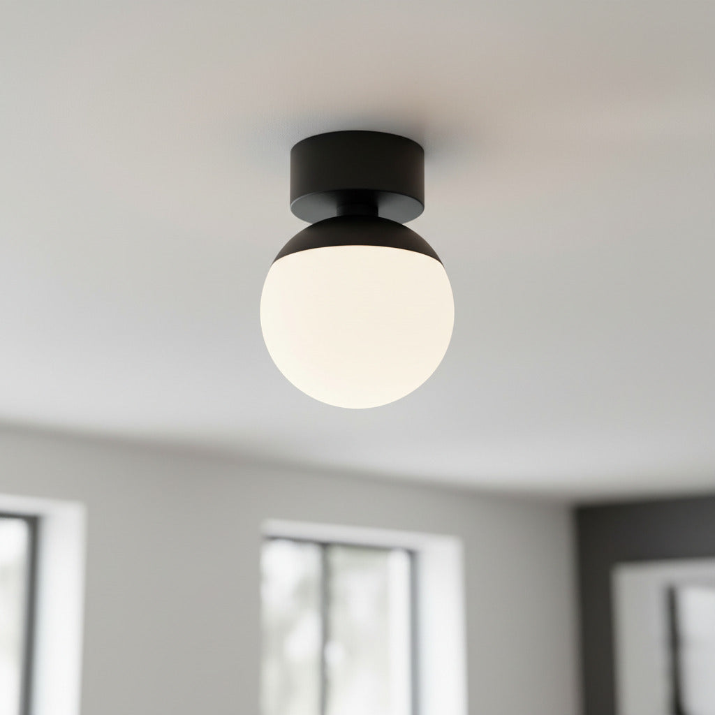 black semi flush ceiling light mounted on the ceiling in a modern home