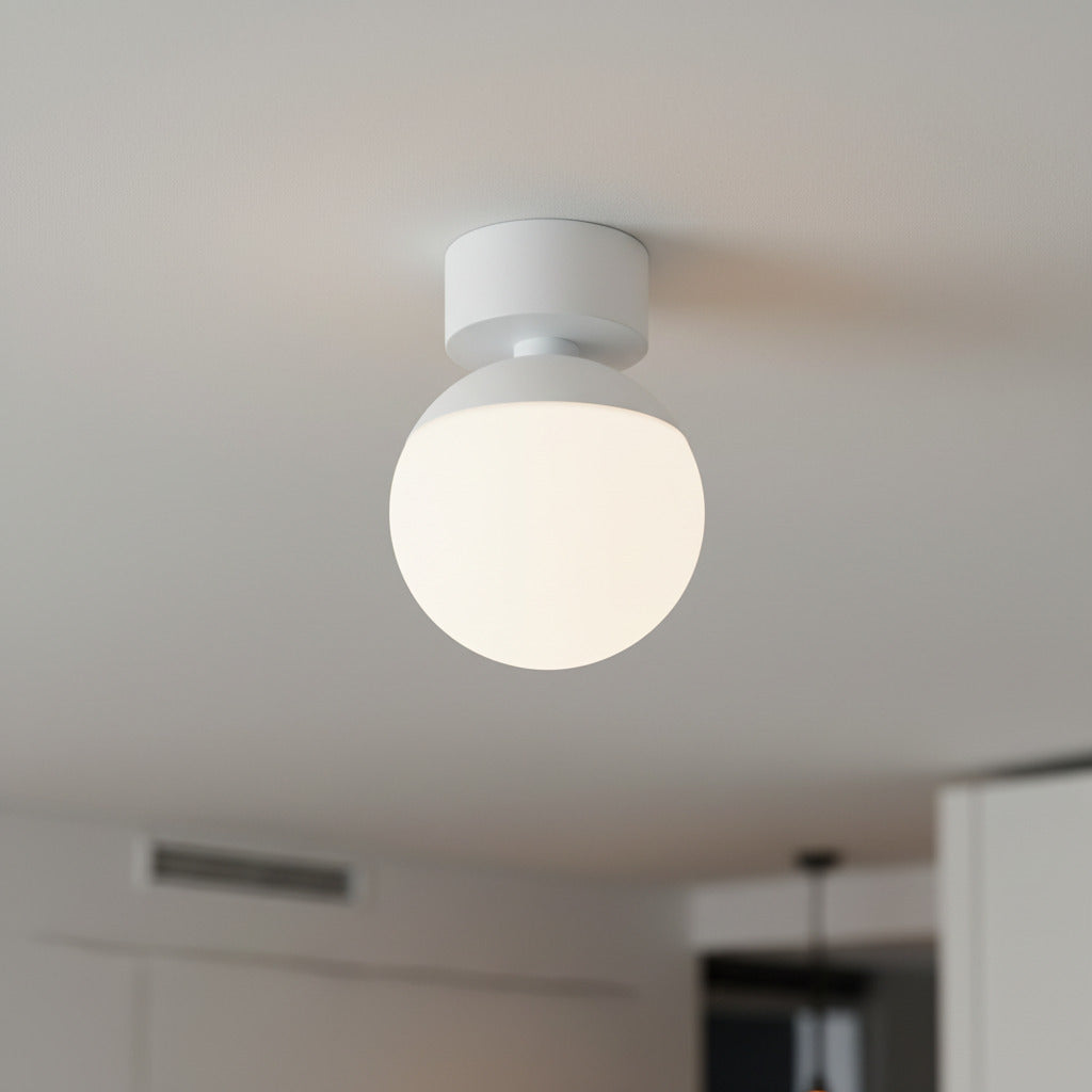white globe ceiling light fixture mounted on the ceiling of a modern home