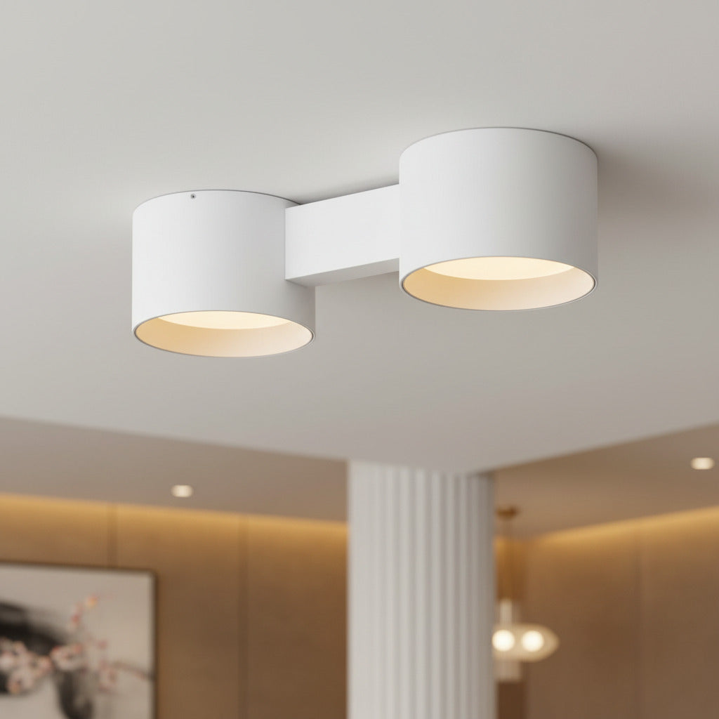 white flush ceiling light fixture mounted on the ceiling of a hotel reception 