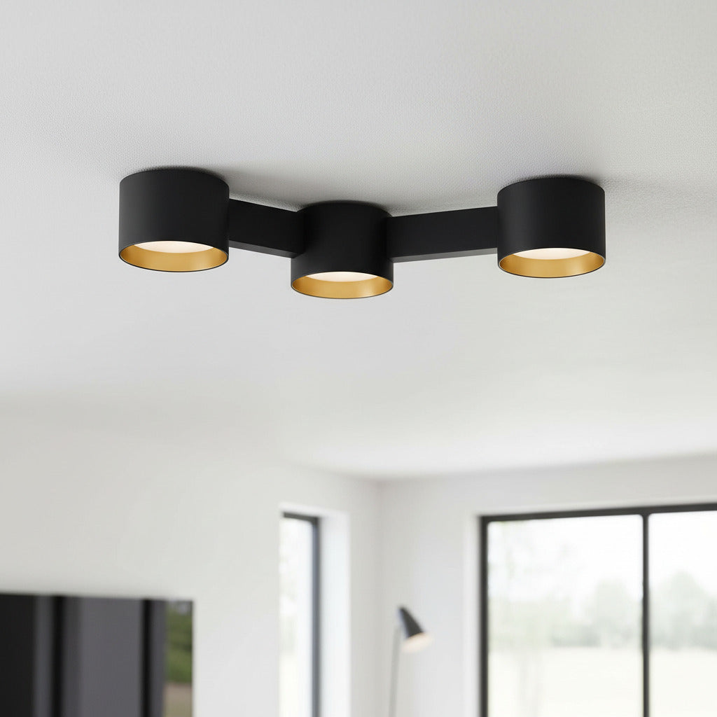 black LED surface downlight mounted on the ceiling in a modern home 