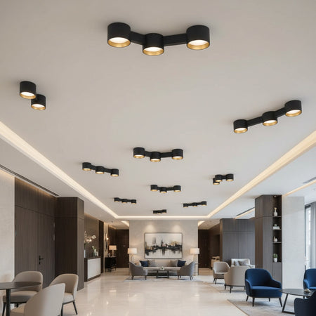 black LED surface downlight mounted on the ceiling in a hotel reception 