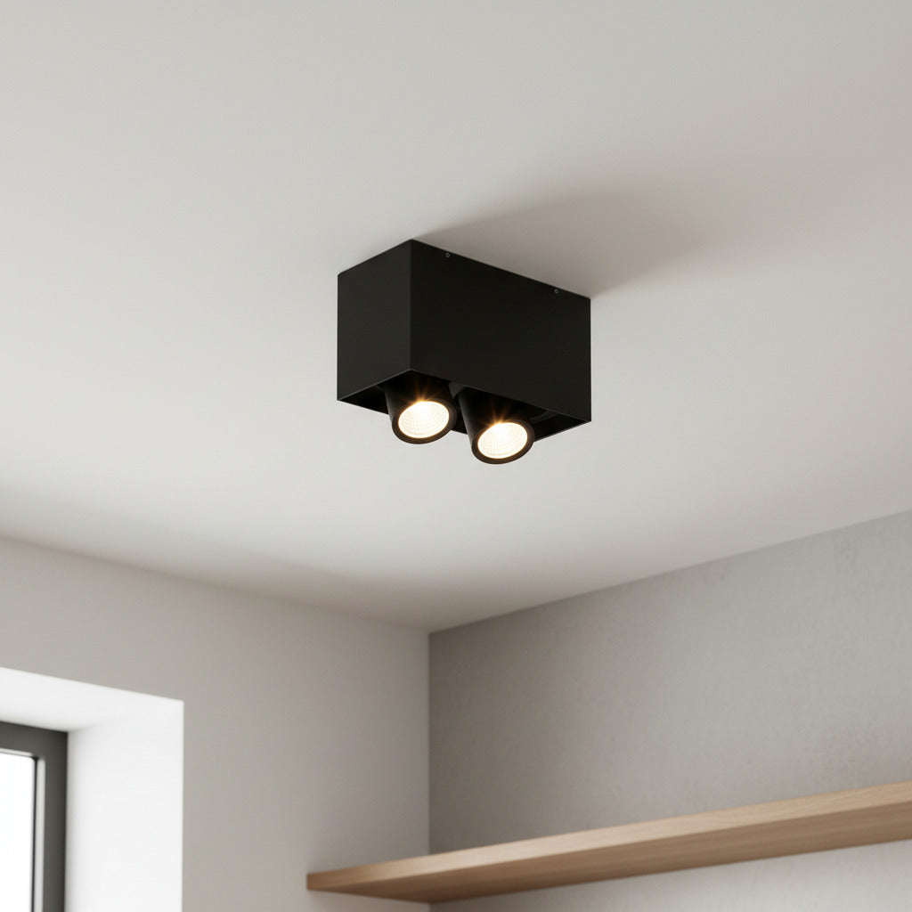 black adjustable LED surface downlight mounted on the ceiling in a modern house