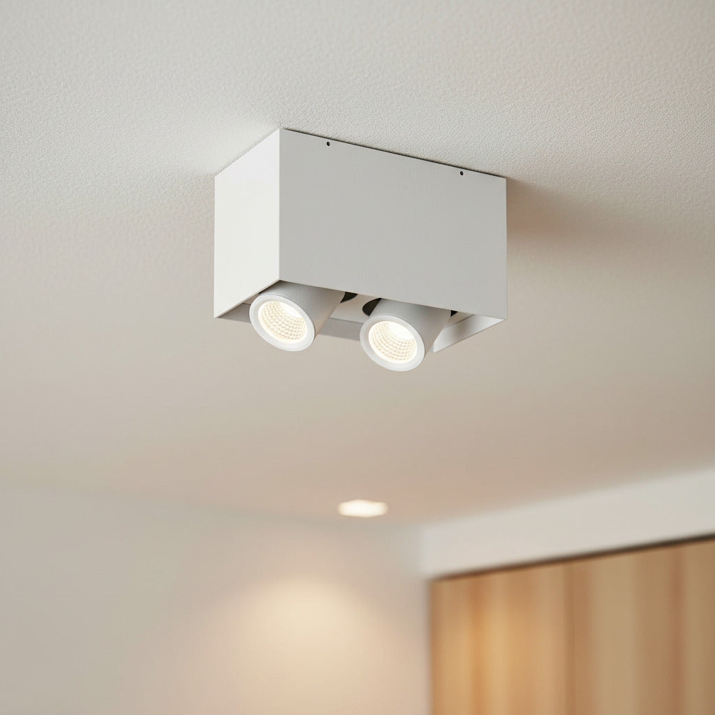 white adjustable LED ceiling light fixture on a white ceiling in a home 