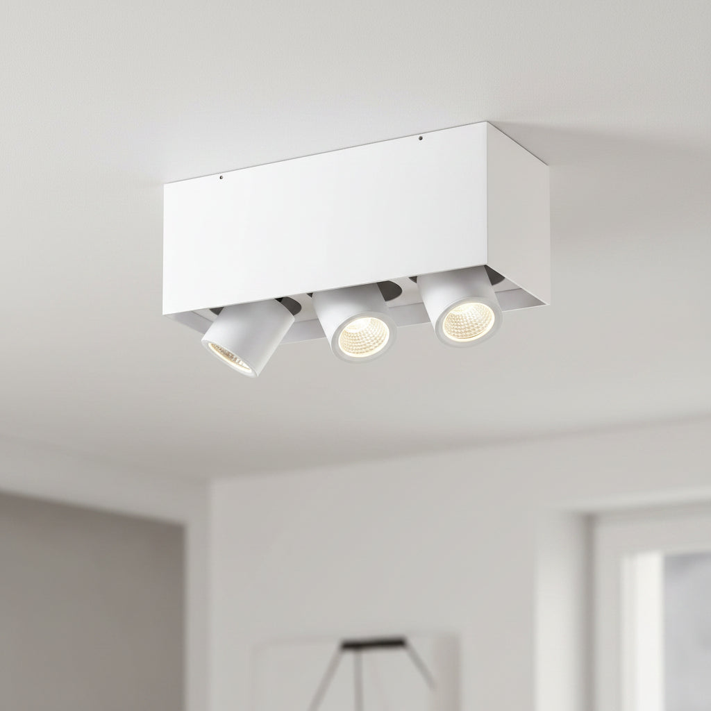 white surface mounted tiltable downlight mounted on the ceiling in a modern home 