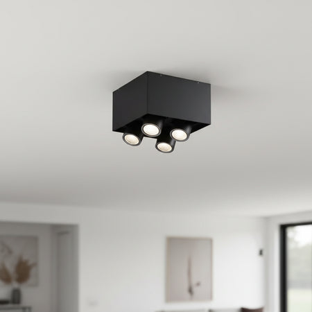 surface mounted black downlight installed on the ceiling in a modern house