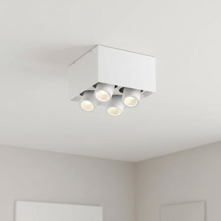 white surface mounted ceiling adjuistable spotlight mounted on the ceiling in a modern home