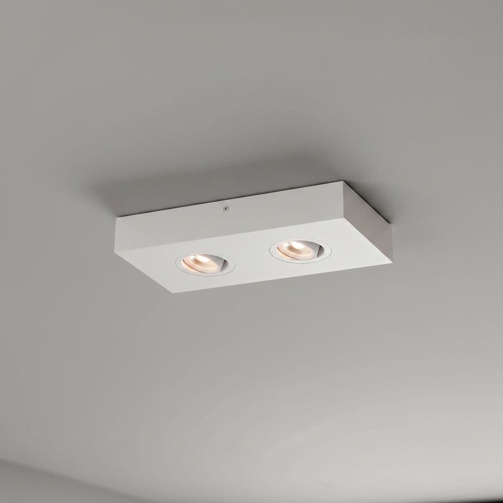 white adjustable LED surface downlight installed in a modern home on a grey ceiling