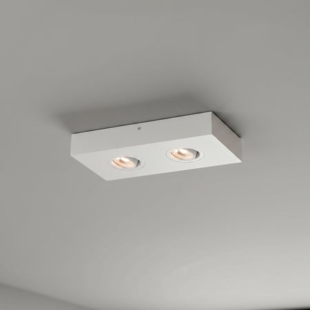 white adjustable LED surface downlight installed in a modern home on a grey ceiling