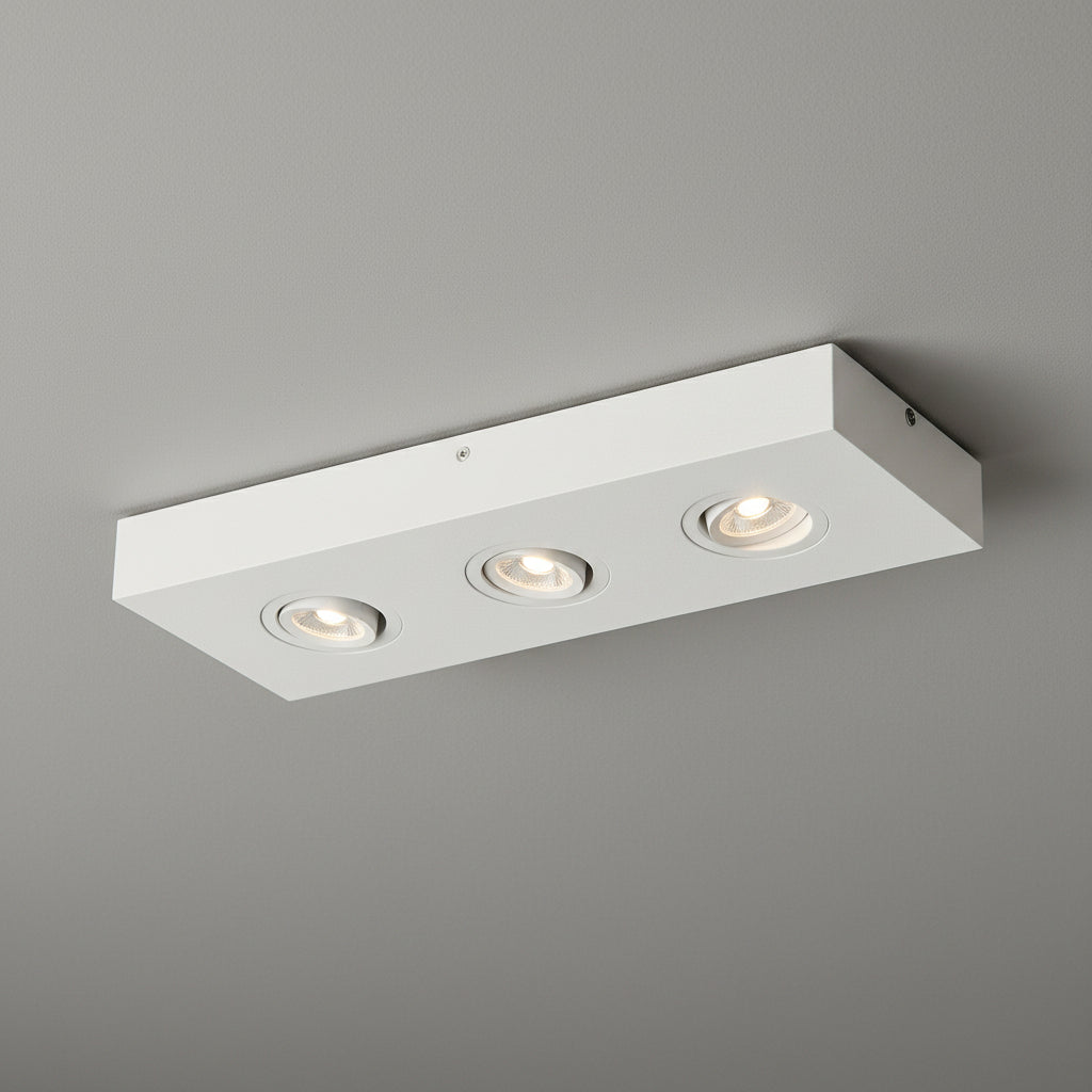 white adjustable surface ceiling spotlight installed on a grey ceiling 