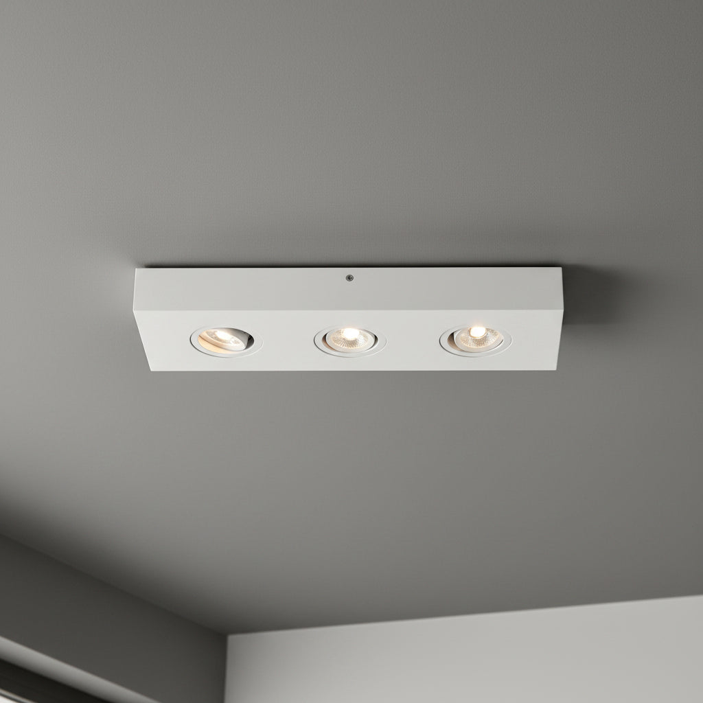 white adjustable surface ceiling spotlight installed on the ceiling in a modern house