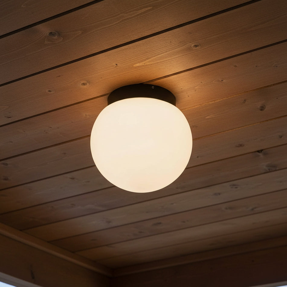 exterior ceiling light fixture mounted on a wooden outdoor ceiling 