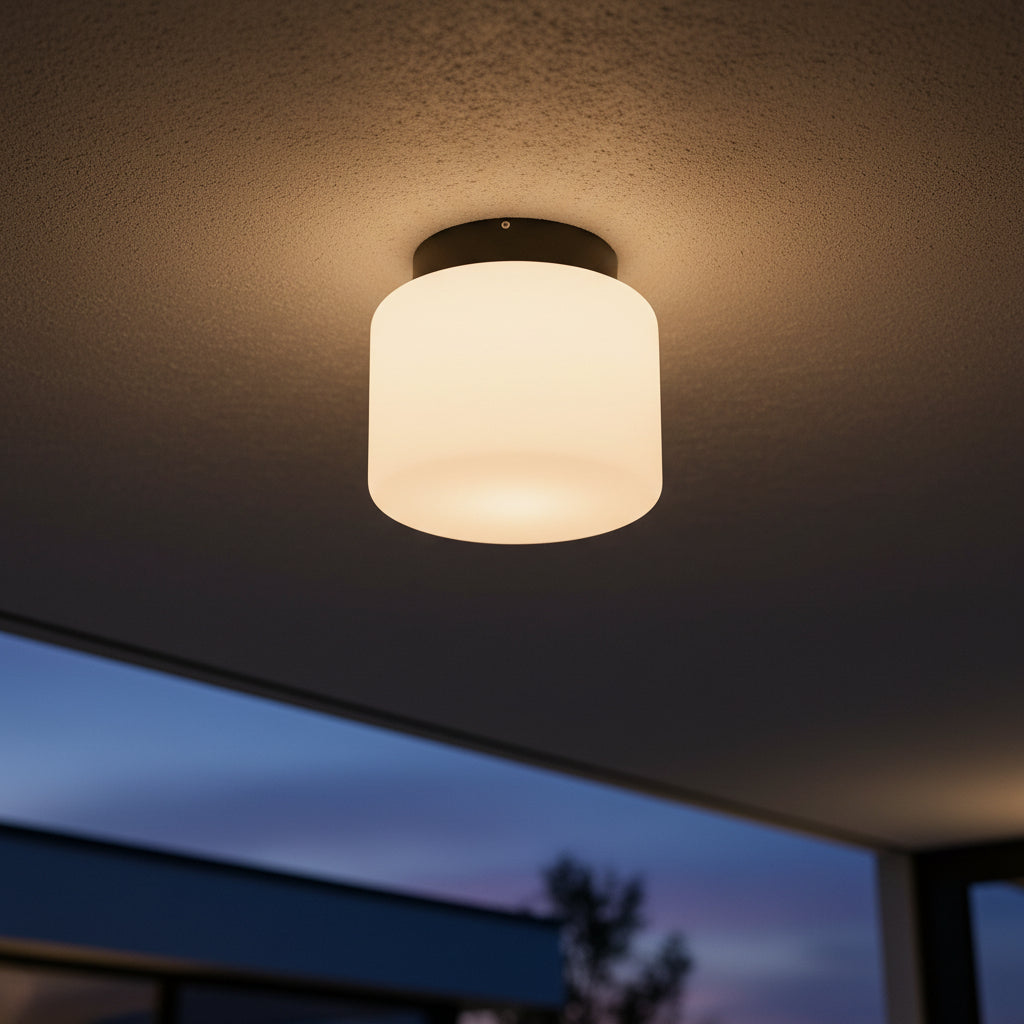 outdoor LED ceiling light shown at night mounted on an exterior porch 