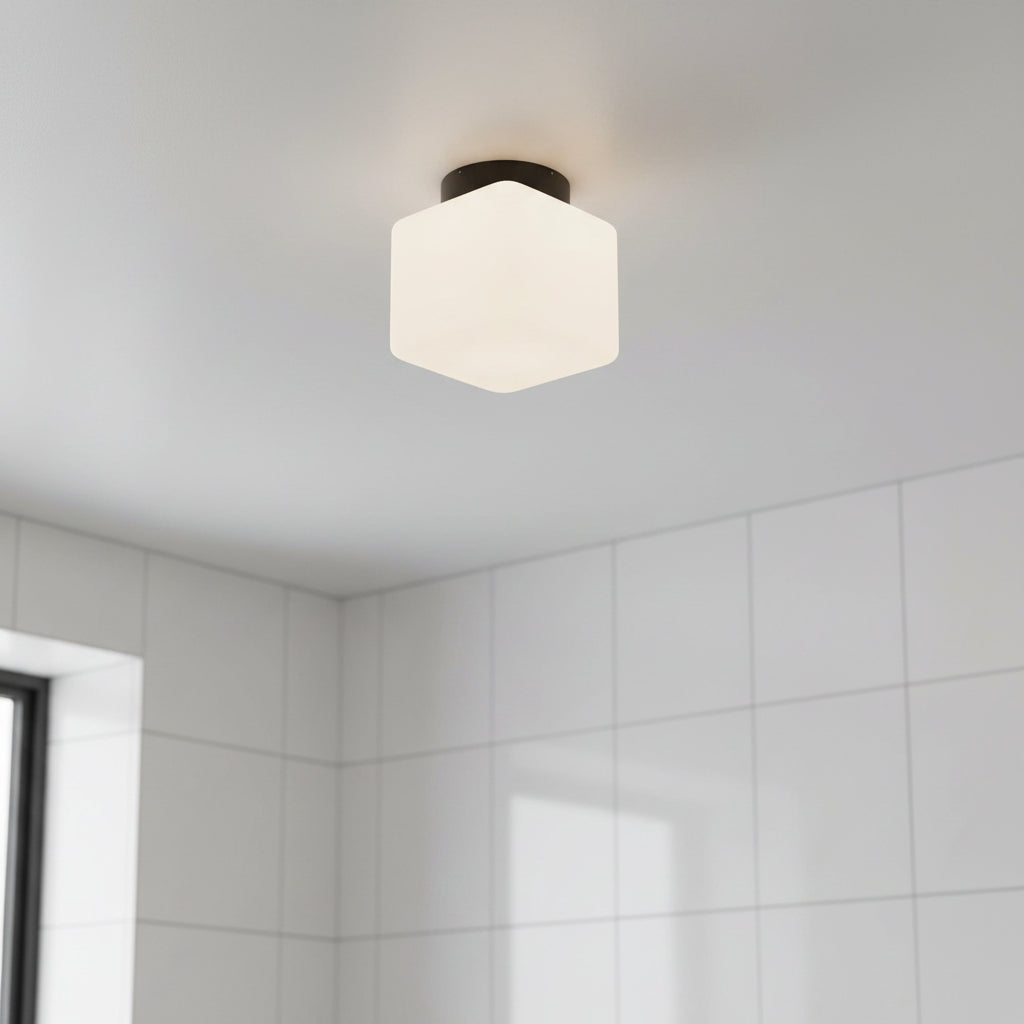 IP65 bathroom ceiling light mounted on a grey ceiling in a bathroom 