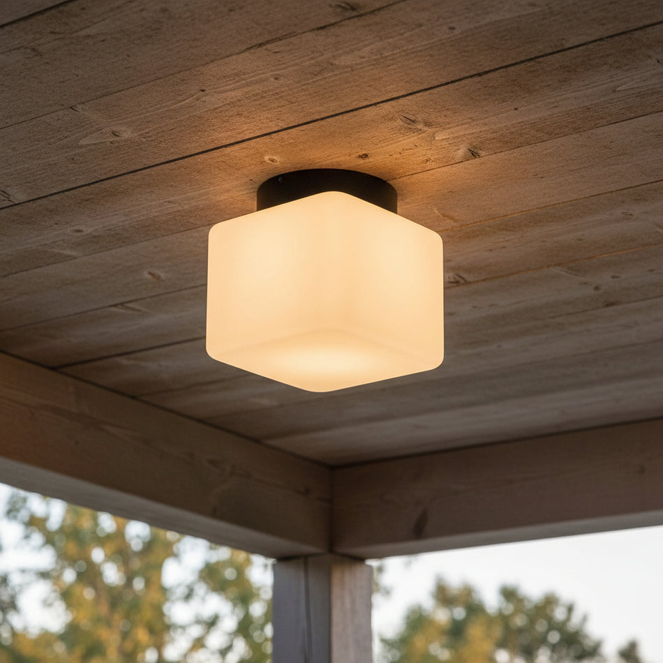 square outdoor ceiling light mounted on a wooden outdoor canopy roof 