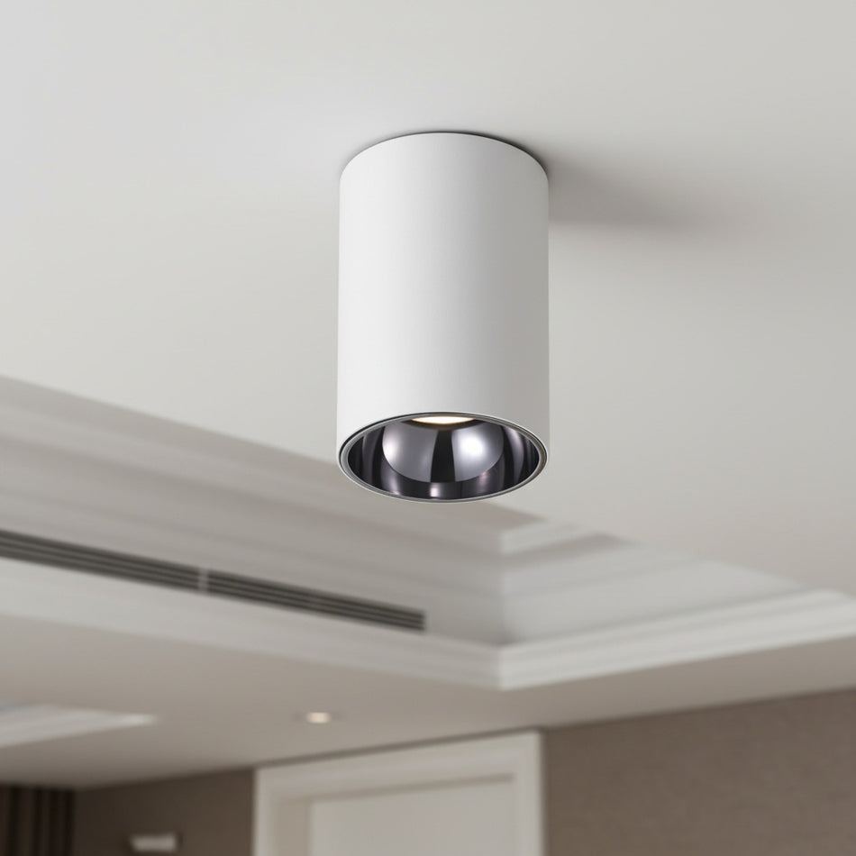 white round surface mounte downlight mounted on the ceiling in a hotel 