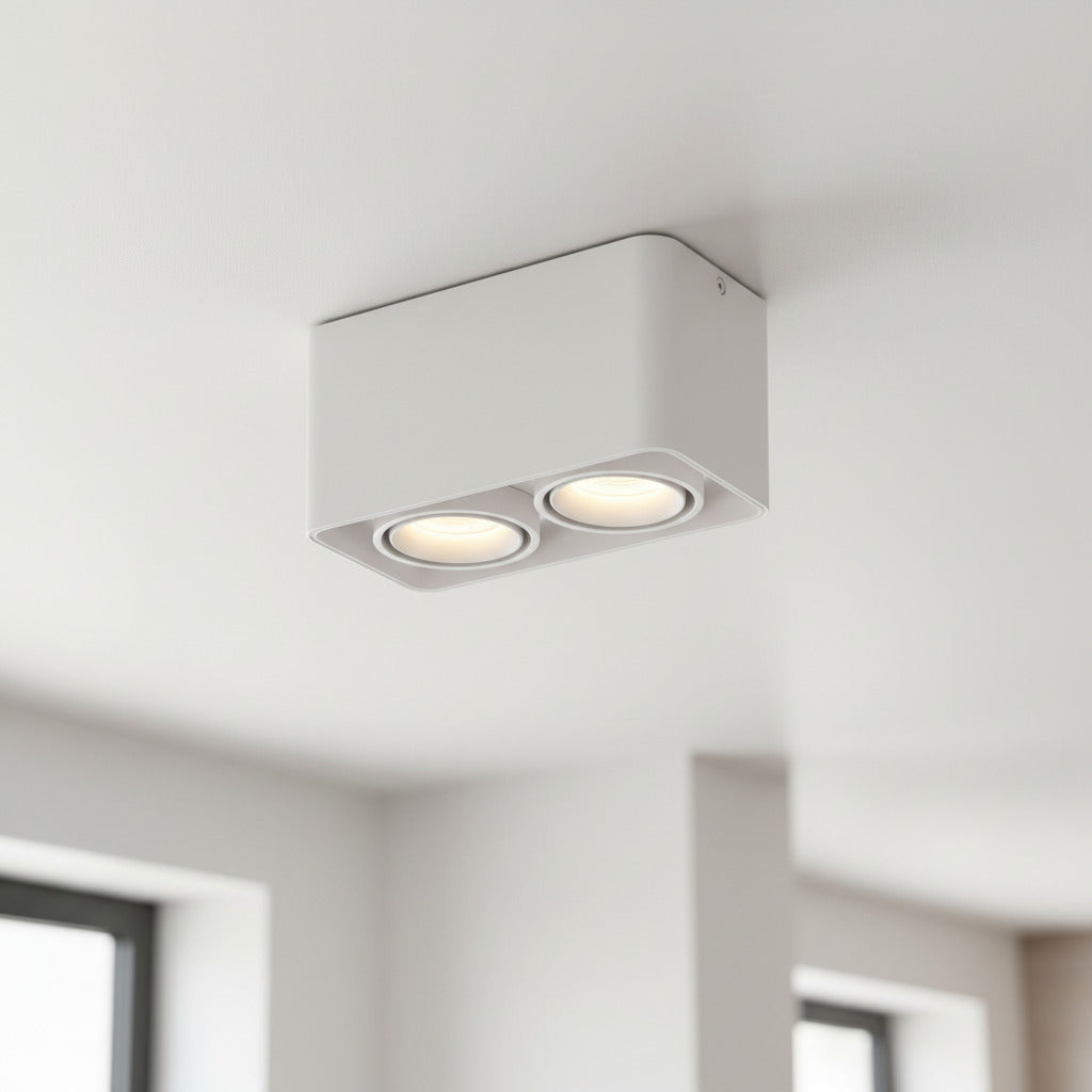 white flush ceiling light fitting mounted on a white ceiling in a kitchen 
