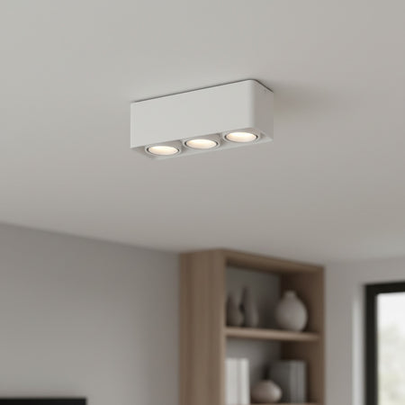 white surface mount spotlights installed on a white ceiling in a home