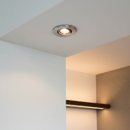 silver mini LED downlight mounted in the alcove of a modern home 