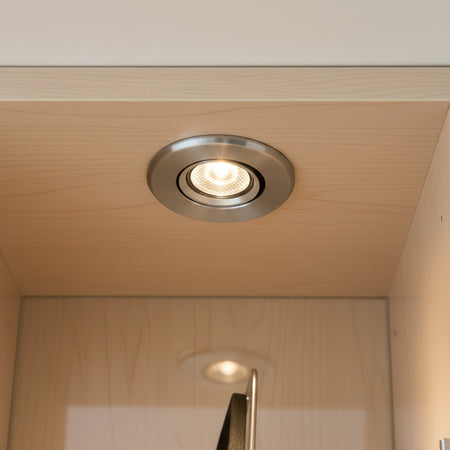 silver mini LED downlight mounted in a display cabinet