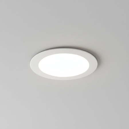 white slimline ceiling downlighter installed in a grey ceiling 