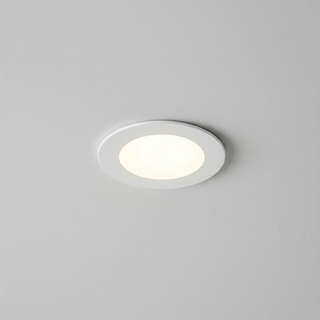 white ultra slim downlight installed on a grey ceiling