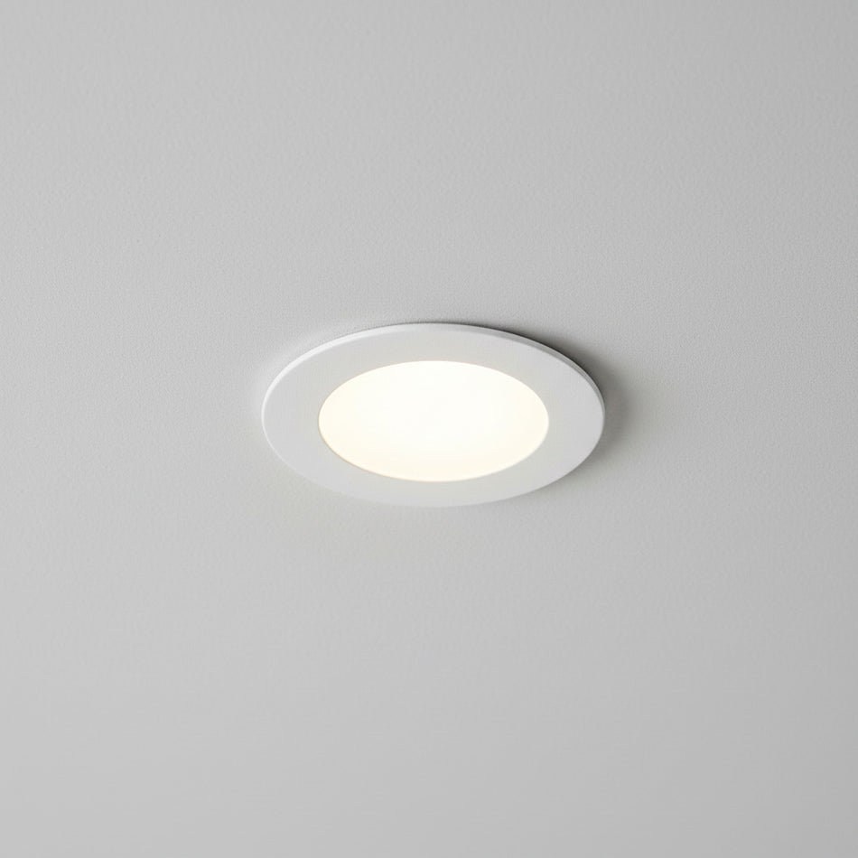 white ultra slim downlight installed on a grey ceiling