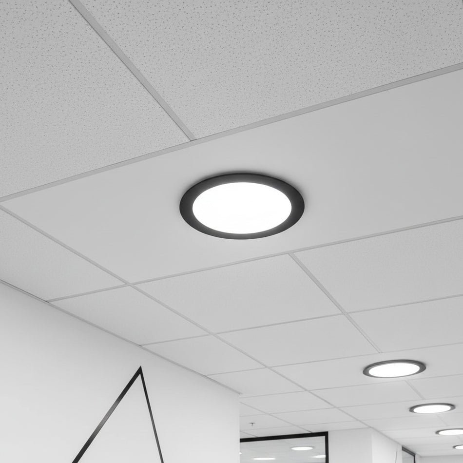 black slimline ceiling downlight installed in a supended ceiling 