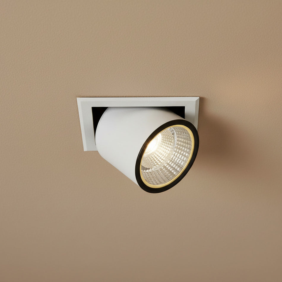 white commercial LED recessed spotlight fitting in a shop ceiling