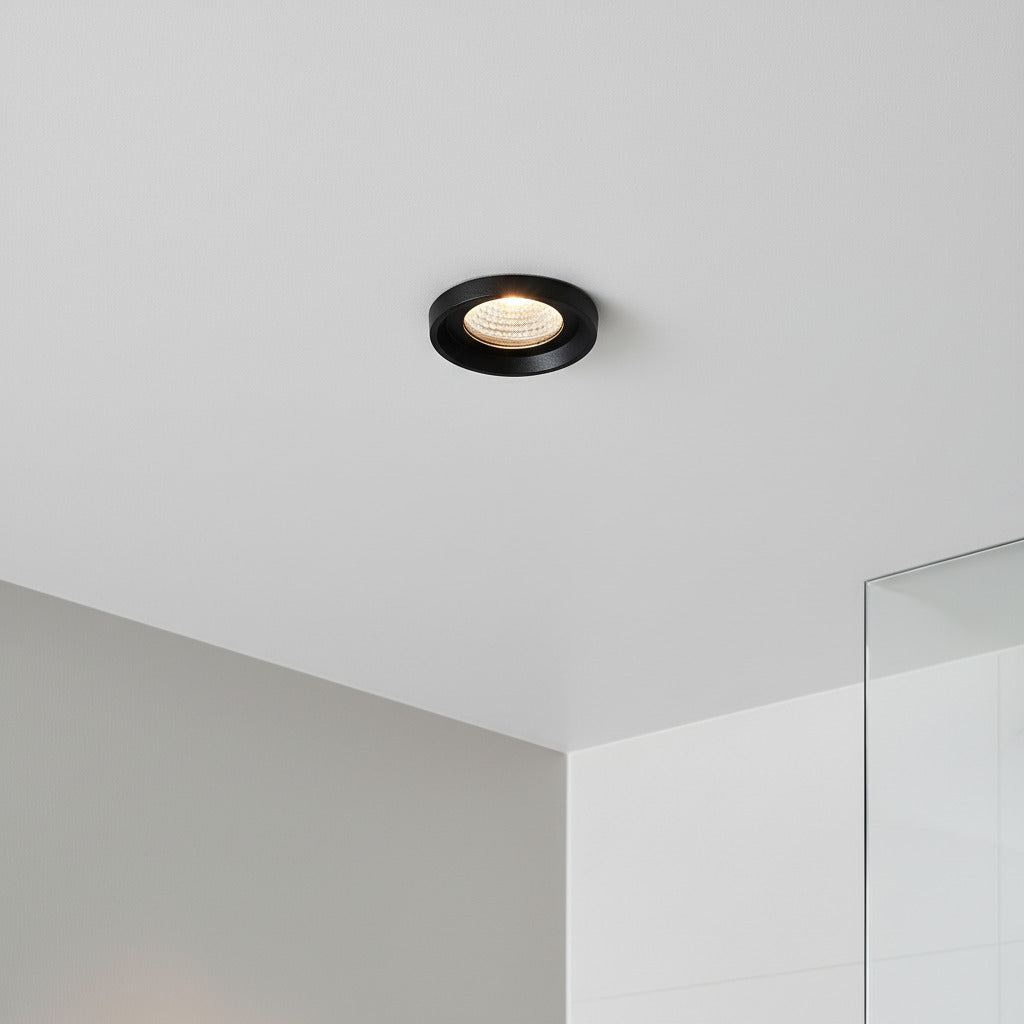 black bathroom ceiling spotlight in a modern shower room 