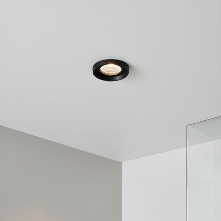 black bathroom ceiling spotlight in a modern shower room 