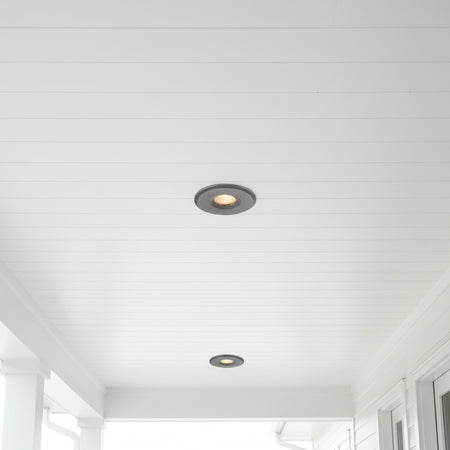 grey small soffit light installed under an outdoor canopy 