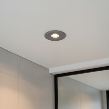 grey small recessed bathroom ceiling light installed in a modern bathroom