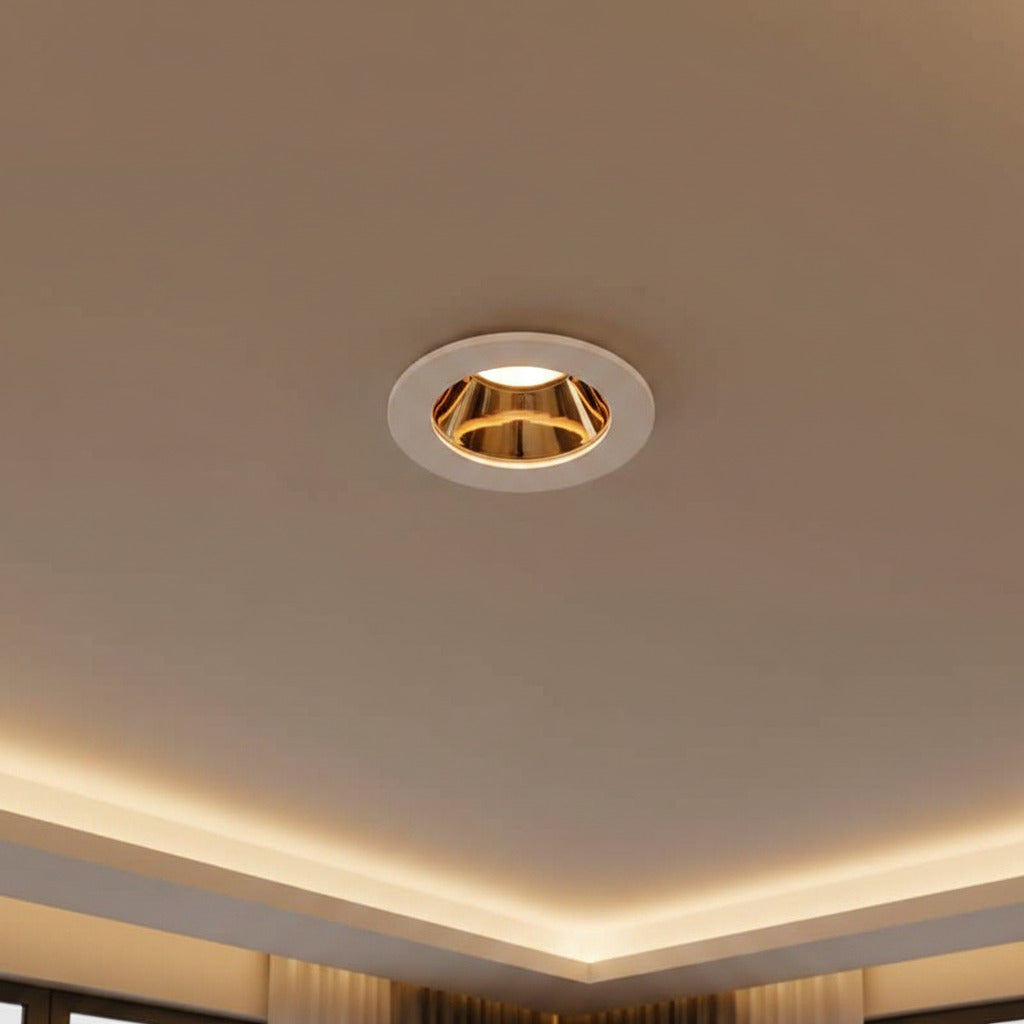 white and gold downlight ceiling light mounted in a modern home ceiling